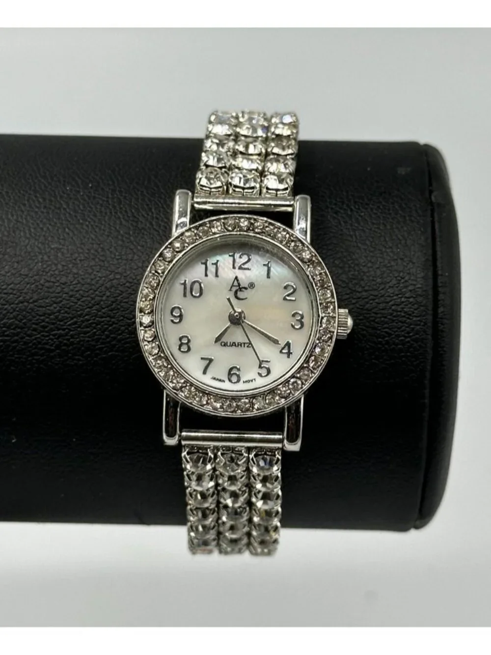 Rhinestone Watch Women Silver Tone Mother of Pearl Dial Stretch New Battery 6.5